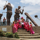 A bride and groom pose for a wedding picture near the Radisson hotel construction site in Abidjan.